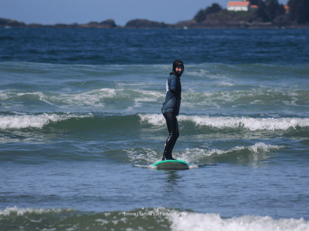 Standing up on my surf in Tofino thanks to our lessons with Adam at Tofino Surf Adventures