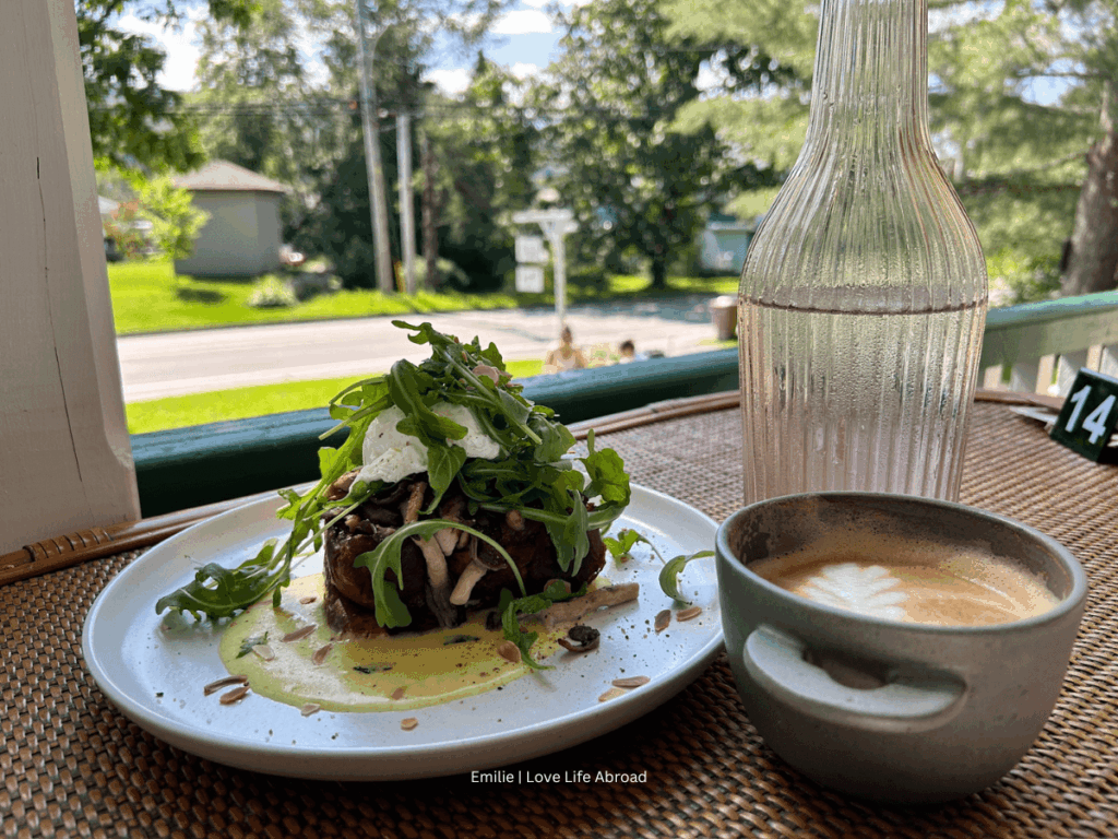 Savoury mushroom and aragula French toast with a latte on the patio of Les Gamines cafe in Stoneham