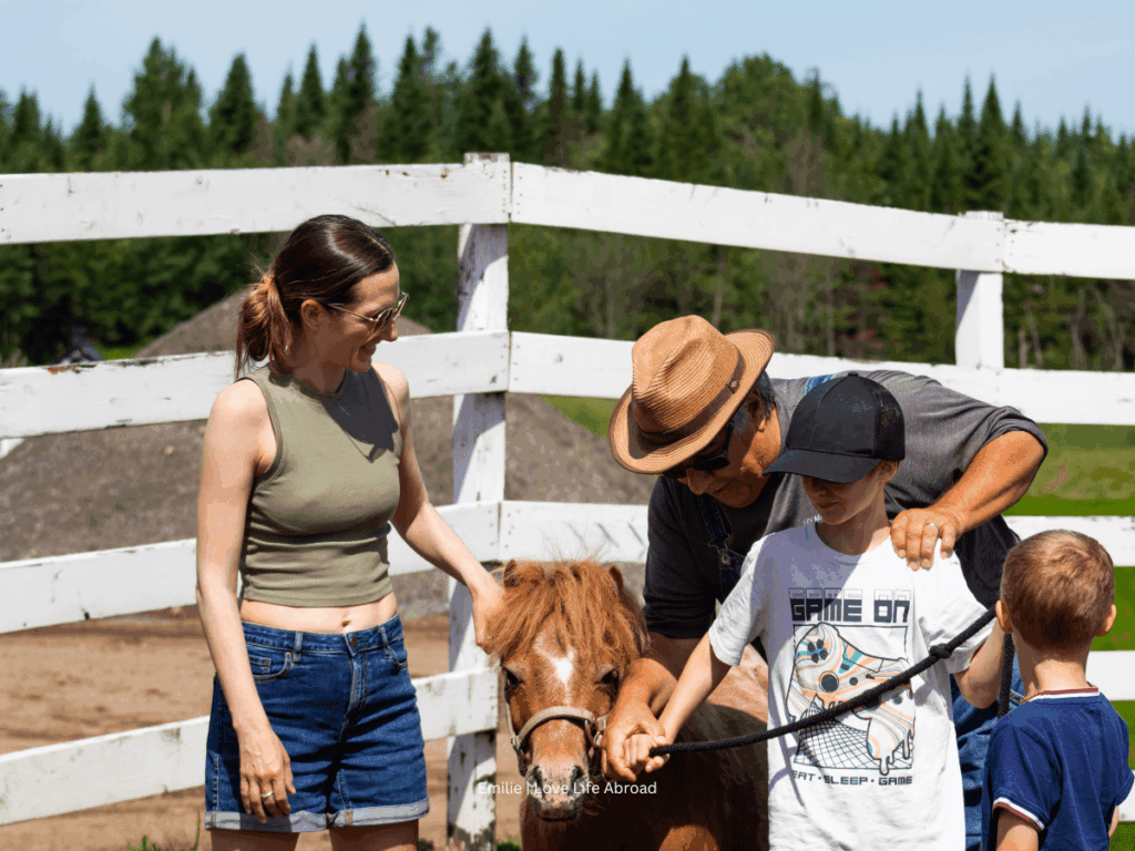 The kids and I walking one of the miniature horses at Expérience Mini-Cheveaux at Lessard Farm