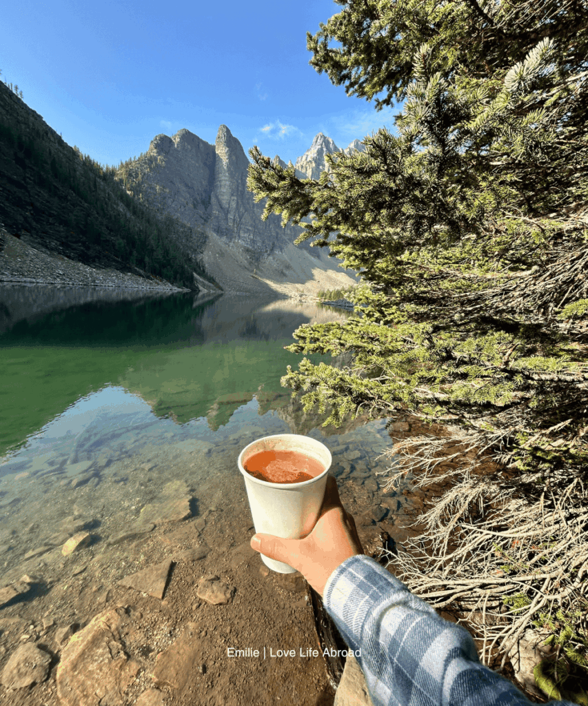Enjoying a warm apple cider from the Lake Agnes Teahouse in Lake Louise
