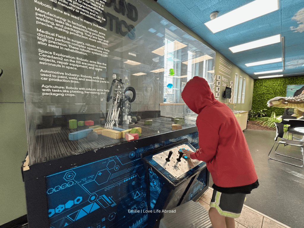 Playing with the robot hand at the Okanagan Science Centre in Vernon