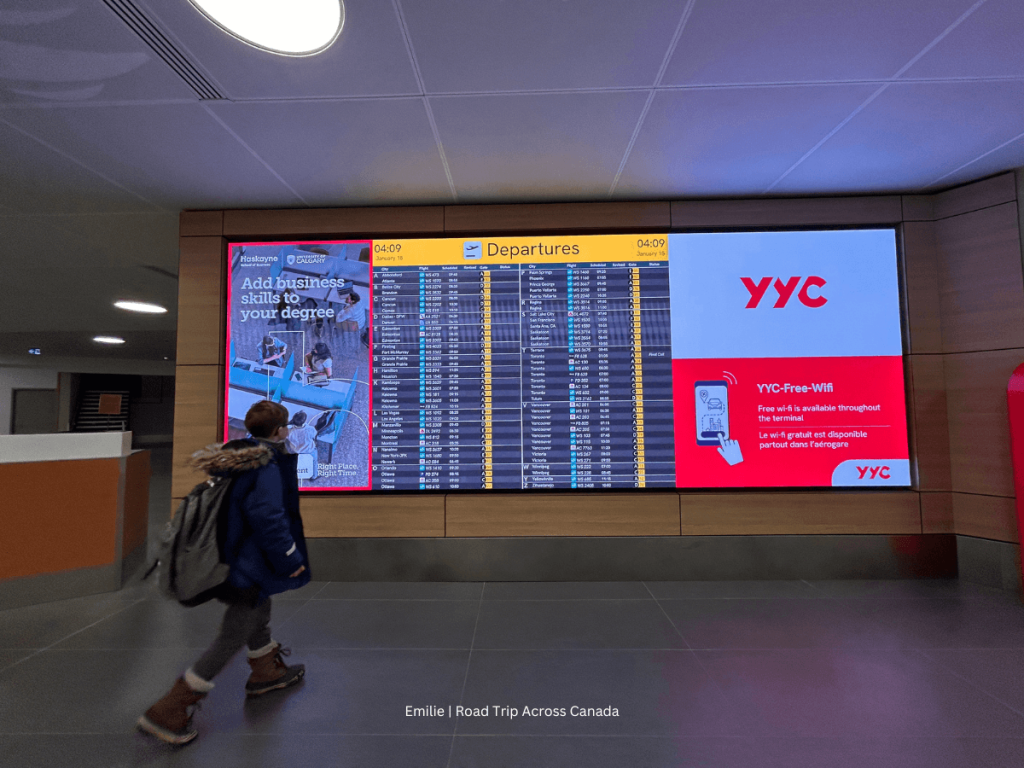 Departure board at Calgary International Airport