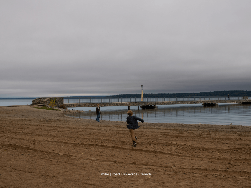 Kids are skipping rocks at the Clear Lake Beach in Riding Mountain National Park in Manitoba