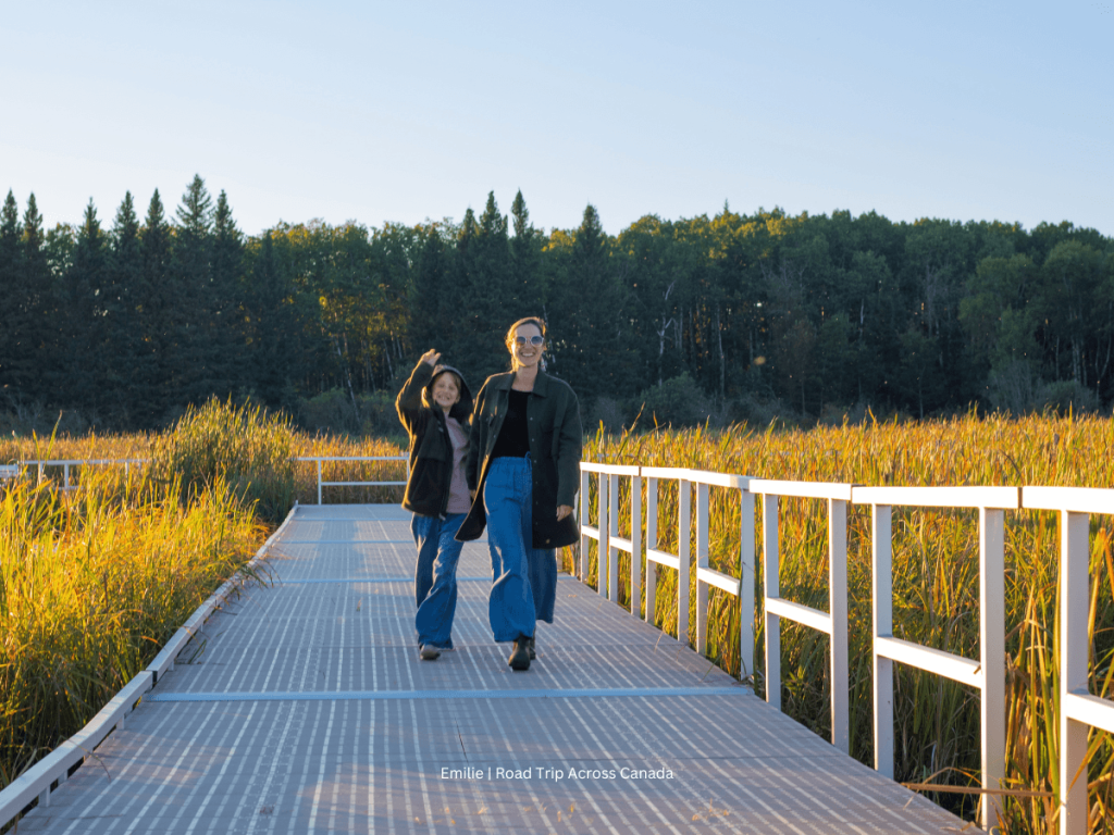 My son and I walking at Sunset on the Ominik Marsh Trail, one of the easy riding mountain national park trails